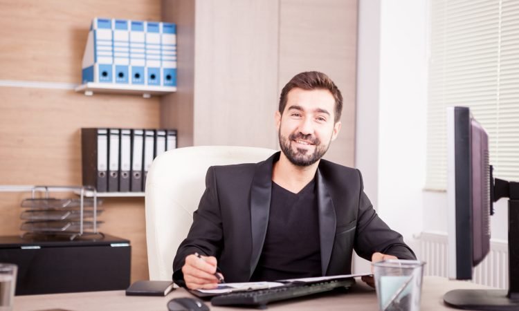 Businessman working at his office. Businessperson in professional environment